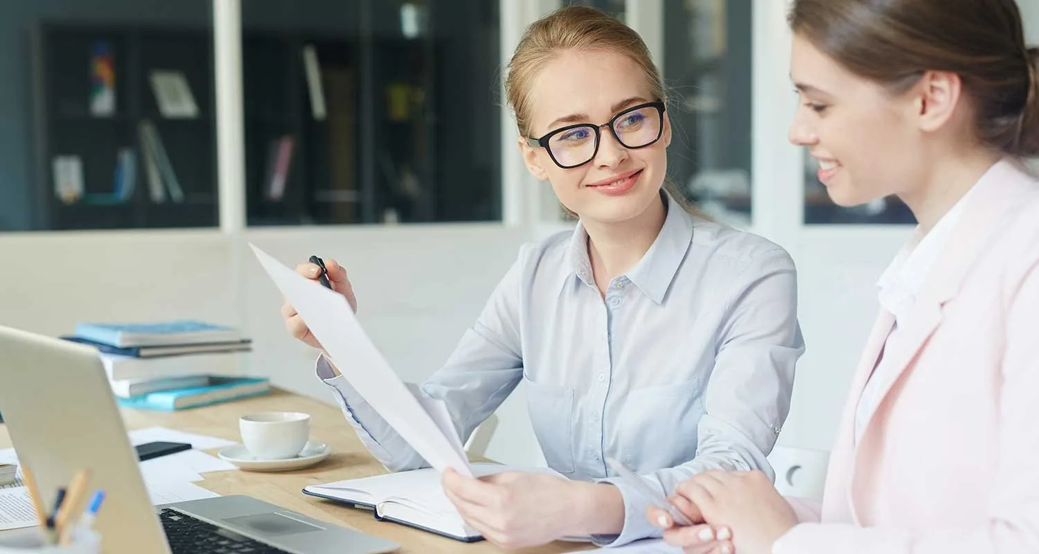 Advisor reviewing documents with a client