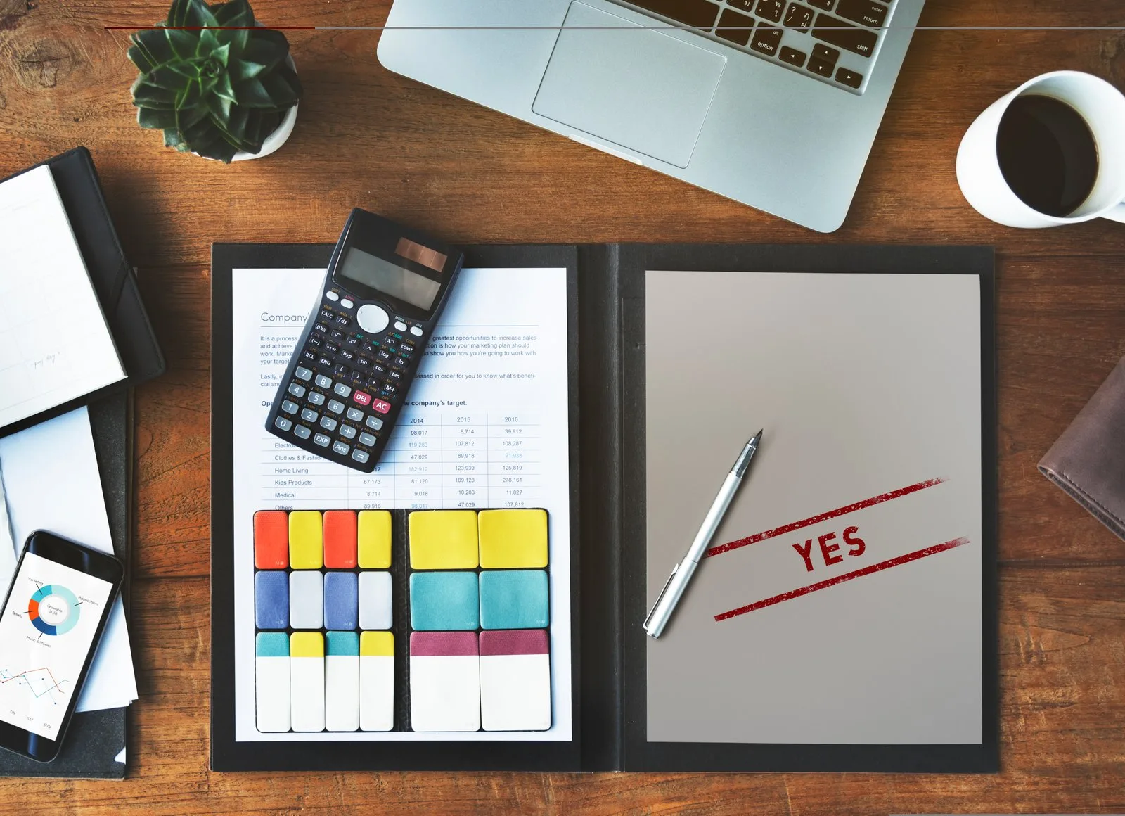 Desk with calculator and financial documents